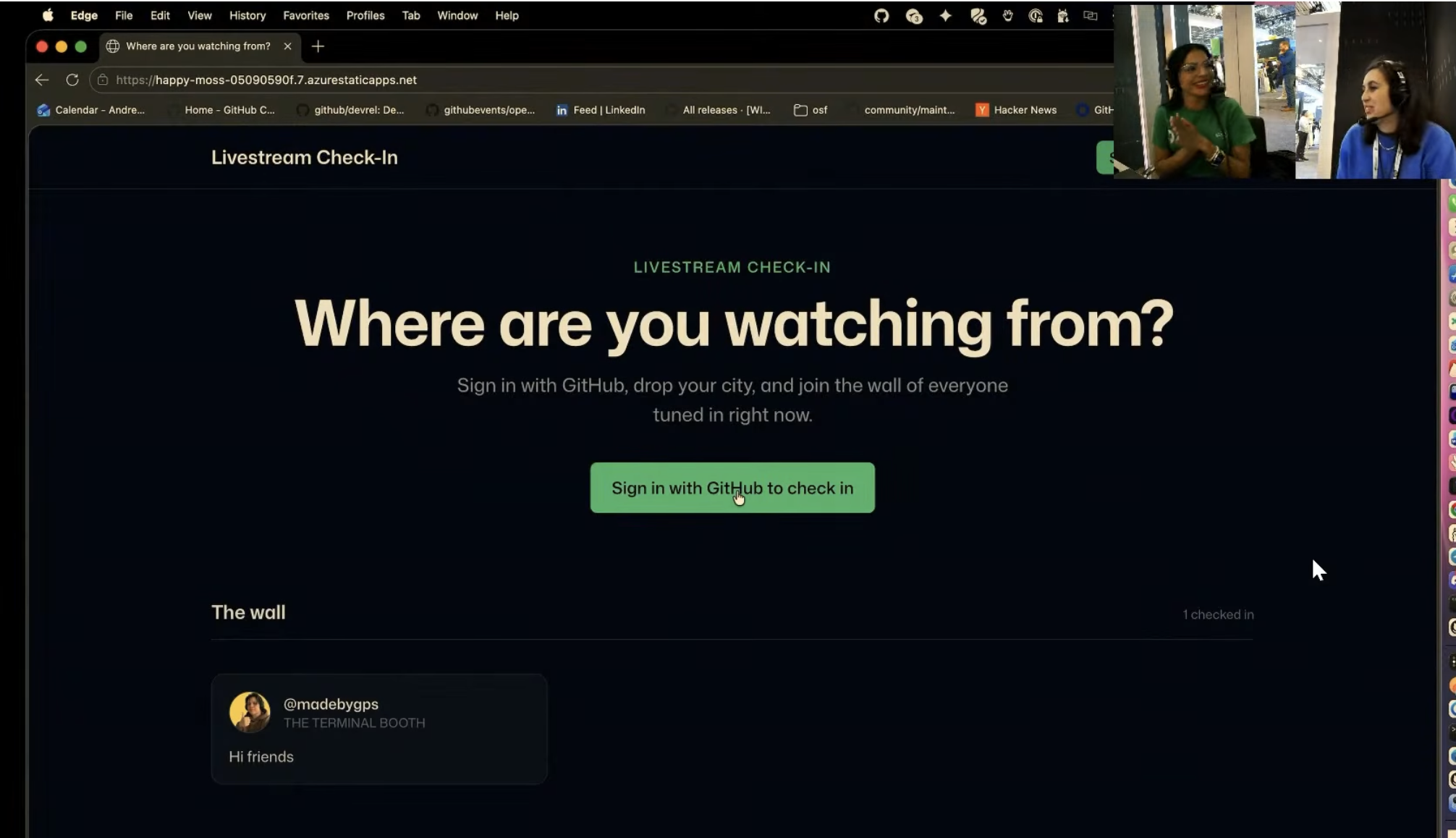 Andrea Griffiths y Cassidy Williams hacen una demo de una app de check-in para livestream durante The Terminal Live en Microsoft Build. La página pregunta "Where are you watching from?" y muestra a viewers iniciando sesión con GitHub para agregar su ciudad al wall.